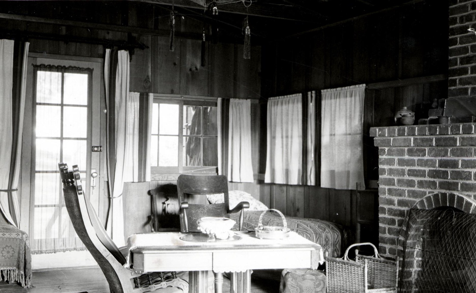 Interior of a Russian River summer cottage near Guerneville in 1926, with simple wooden furniture